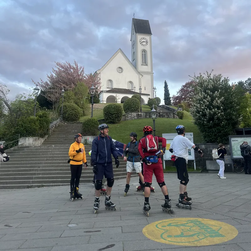 Inline skaters outside a church in Switzerland