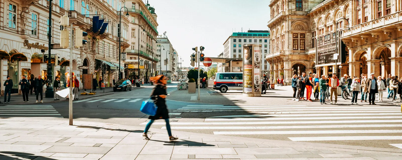 Skaters and pedestrians in a Vienna city centre square